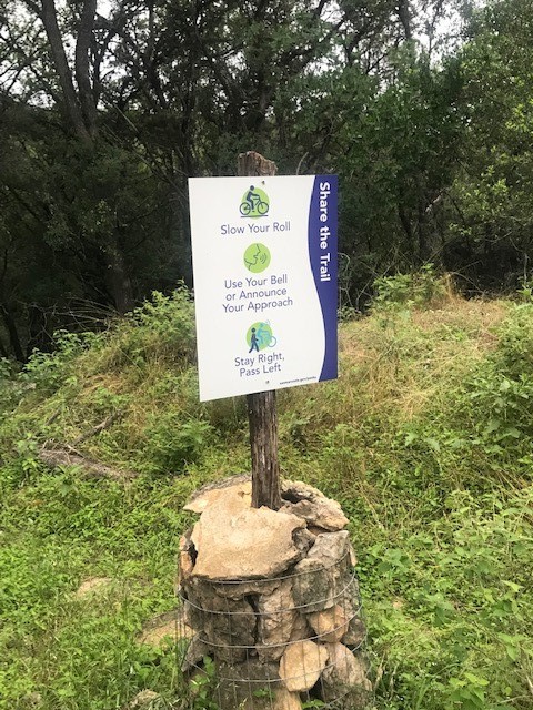 211 Ridgewood Drive San Marcos, TX 78666 - Photo 24 of 26 a sign that is sitting on a brick wall