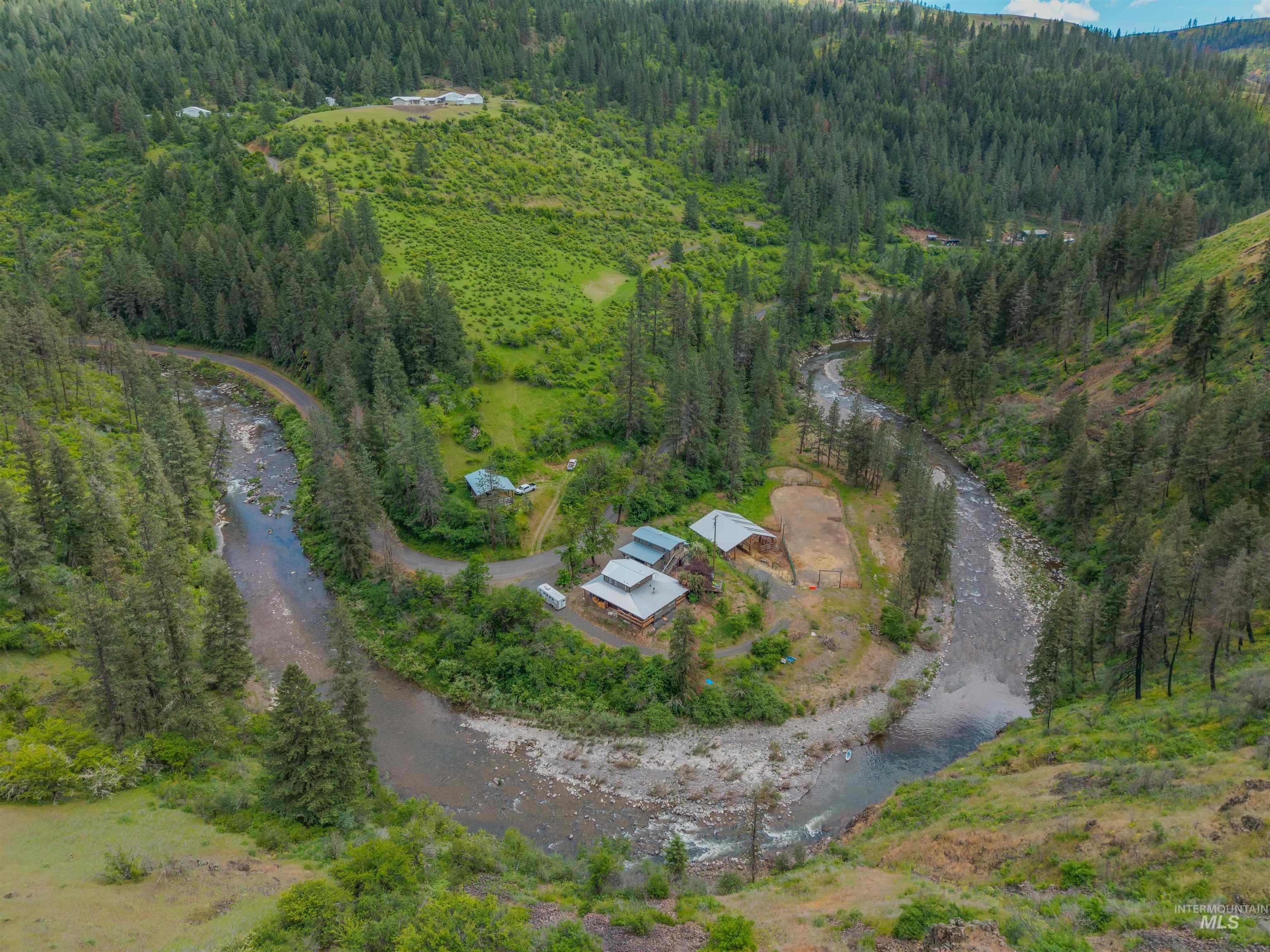 1314 Cedar Ridge Road Kendrick, ID 83537 - Photo 47 of 50 Aerial perspective showcasing a secluded property site within a forested valley