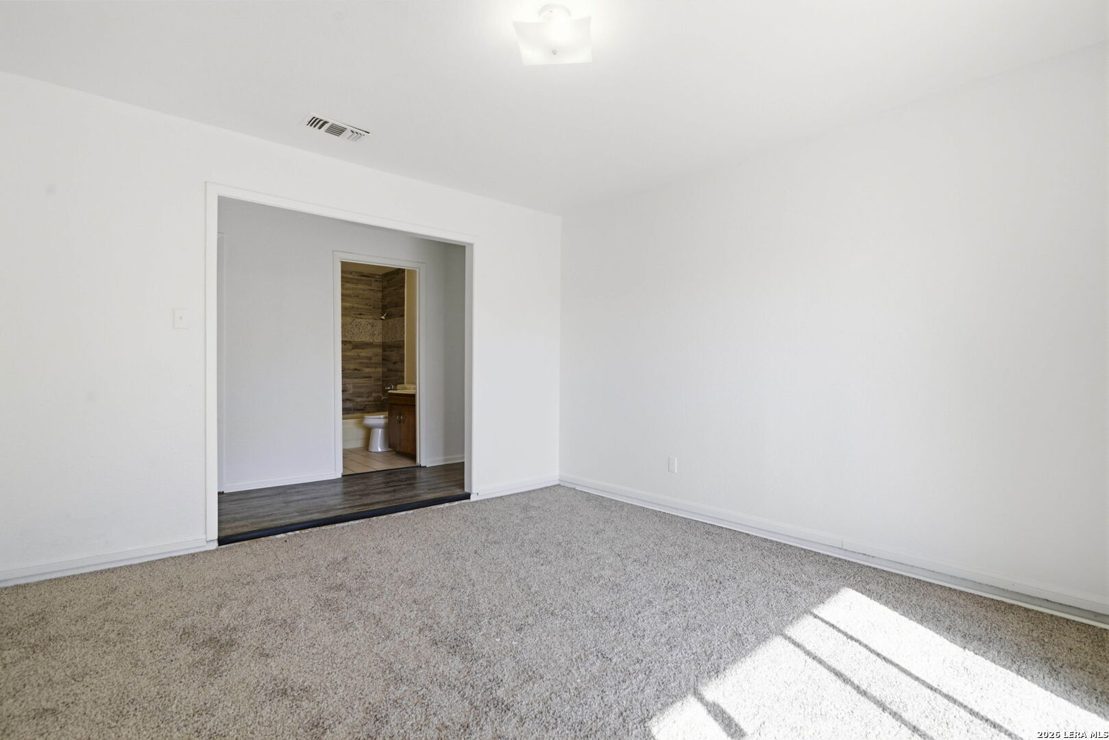 508 Crouch Avenue Devine, TX 78016 - Photo 12 of 26 a view of an empty room and window