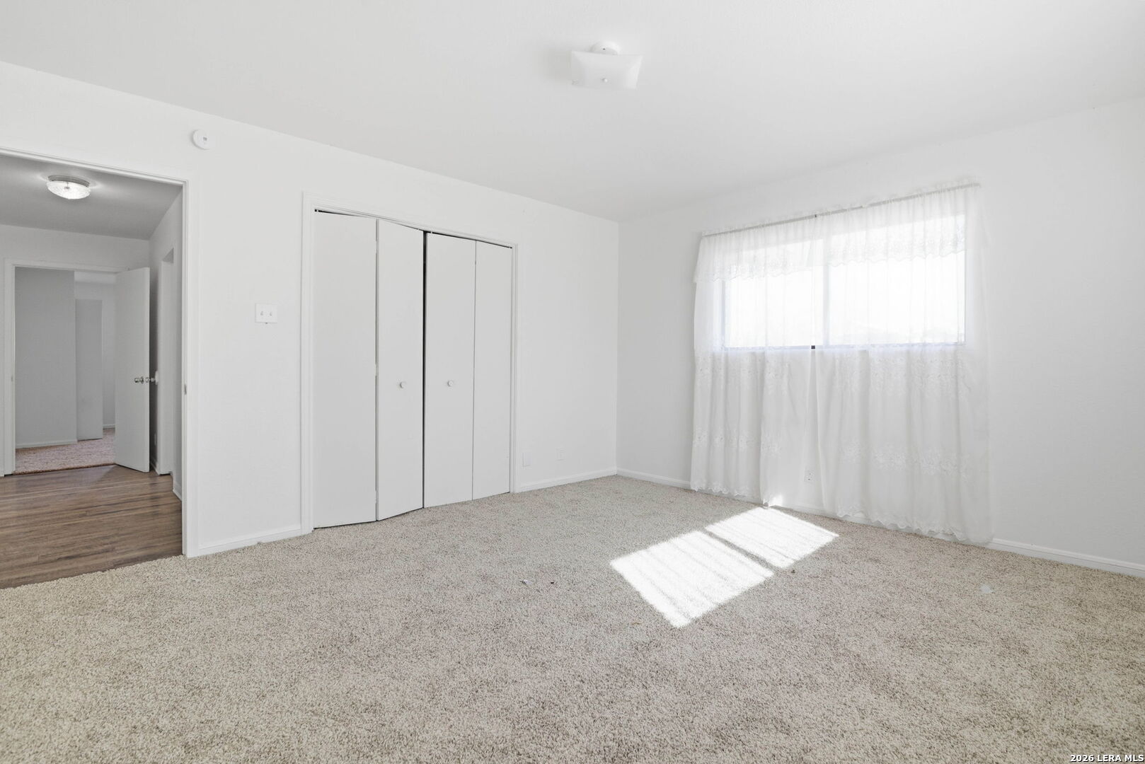 508 Crouch Avenue Devine, TX 78016 - Photo 17 of 26 an empty room with windows