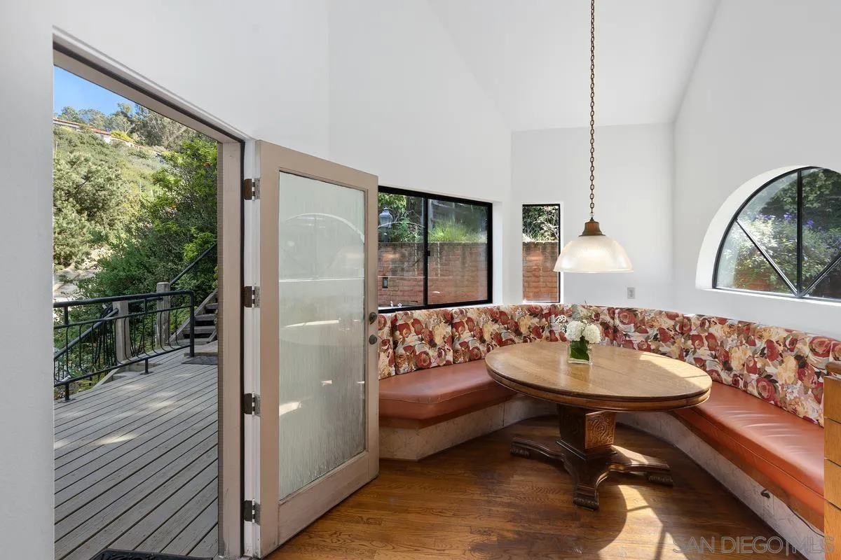 1888 Puente Drive La Jolla, CA 92037 - Photo 16 of 30 a living room with furniture and a large window