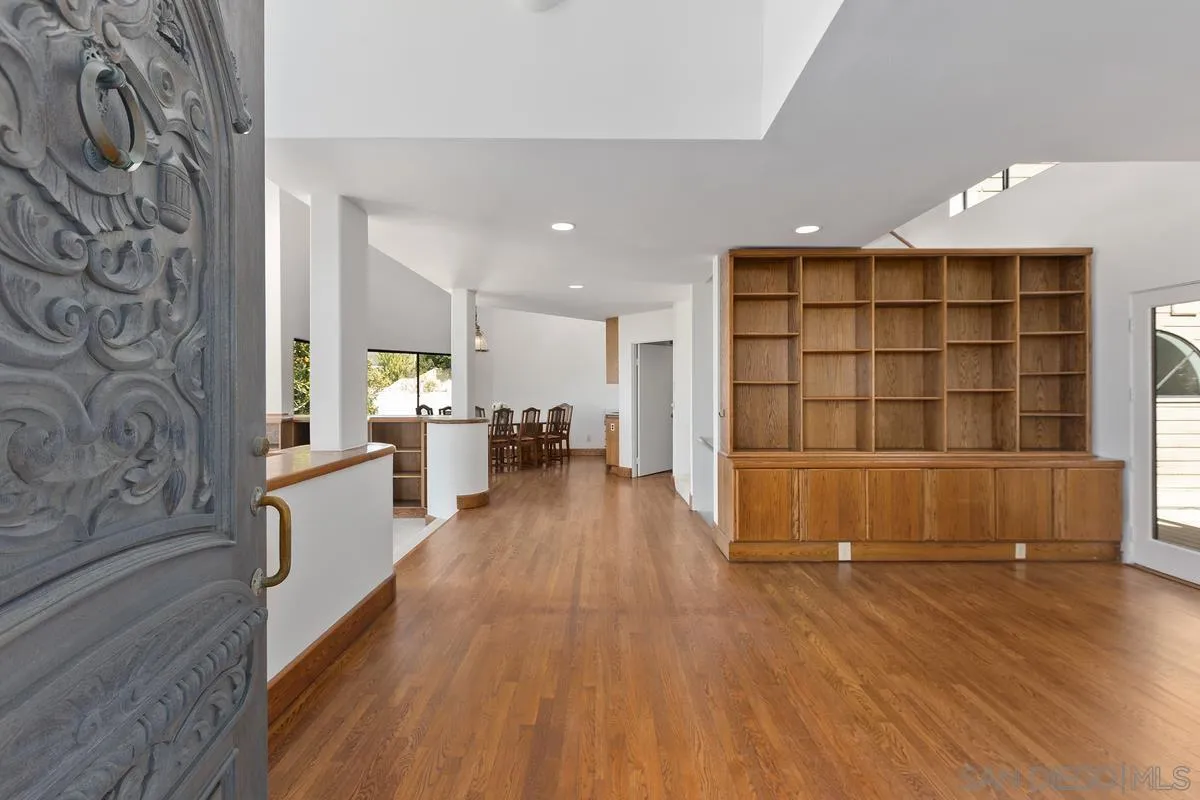 1888 Puente Drive La Jolla, CA 92037 - Photo 19 of 30 a view of a kitchen with furniture and wooden floor