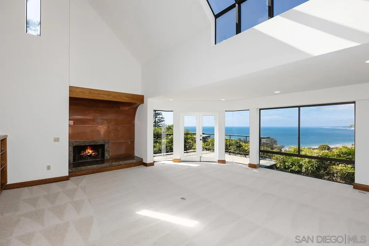 1888 Puente Drive La Jolla, CA 92037 - Photo 3 of 30 a view of a big room with windows and chandelier