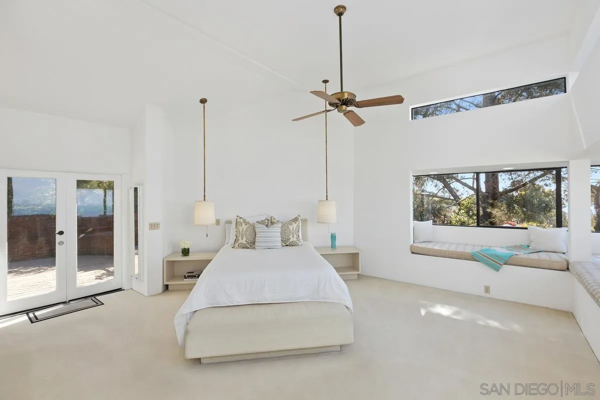 1888 Puente Drive La Jolla, CA 92037 - Photo 8 of 30 a living room with furniture and a floor to ceiling window