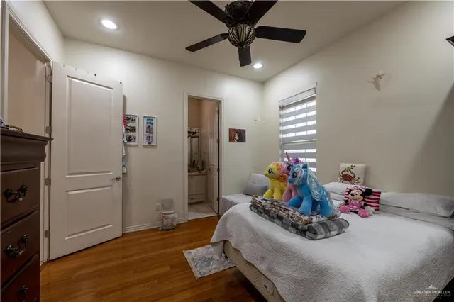 a bed room with a bed and a flat screen tv