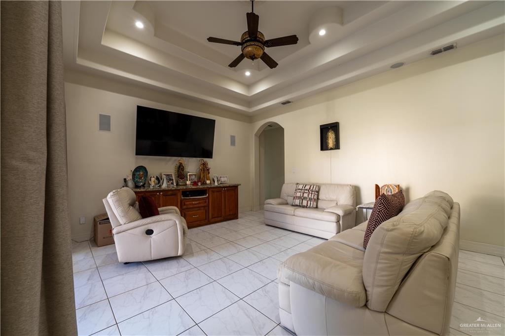 3801 South L Street McAllen, TX 78503 - Photo 31 of 45 a living room with furniture and a flat screen tv