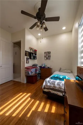 a bedroom with bed and window