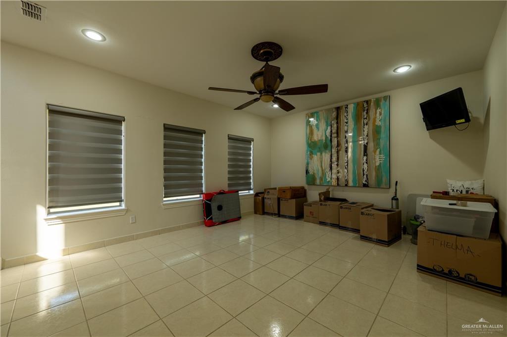 3801 South L Street McAllen, TX 78503 - Photo 38 of 45 a living room with furniture and a flat screen tv