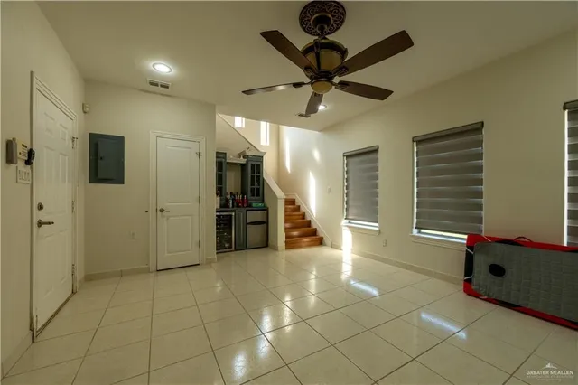 a view of a livingroom with a furniture and a ceiling fan