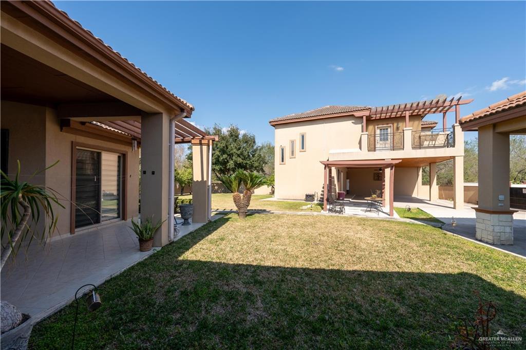 3801 South L Street McAllen, TX 78503 - Photo 43 of 45 a view of house with yard outdoor seating and barbeque oven