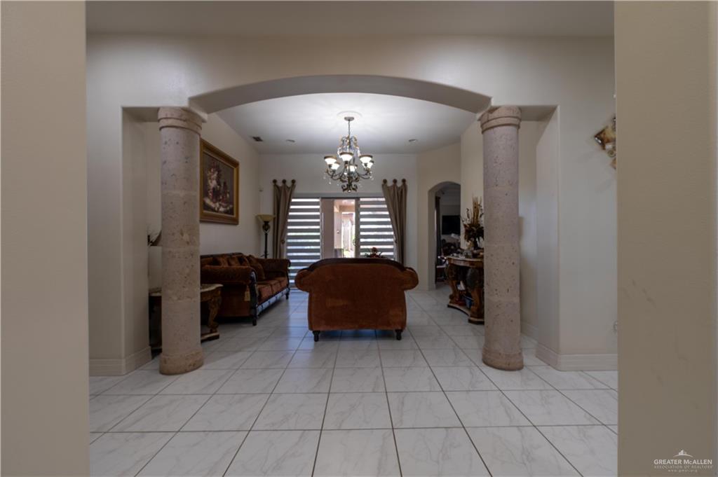 3801 South L Street McAllen, TX 78503 - Photo 7 of 45 a living room with furniture and a chandelier