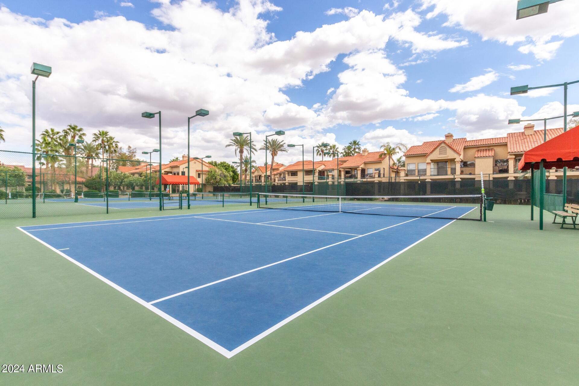 9705 East Mountain View Road, Unit 1036 Scottsdale, AZ 85258 - Photo 27 of 50 a view of a tennis court