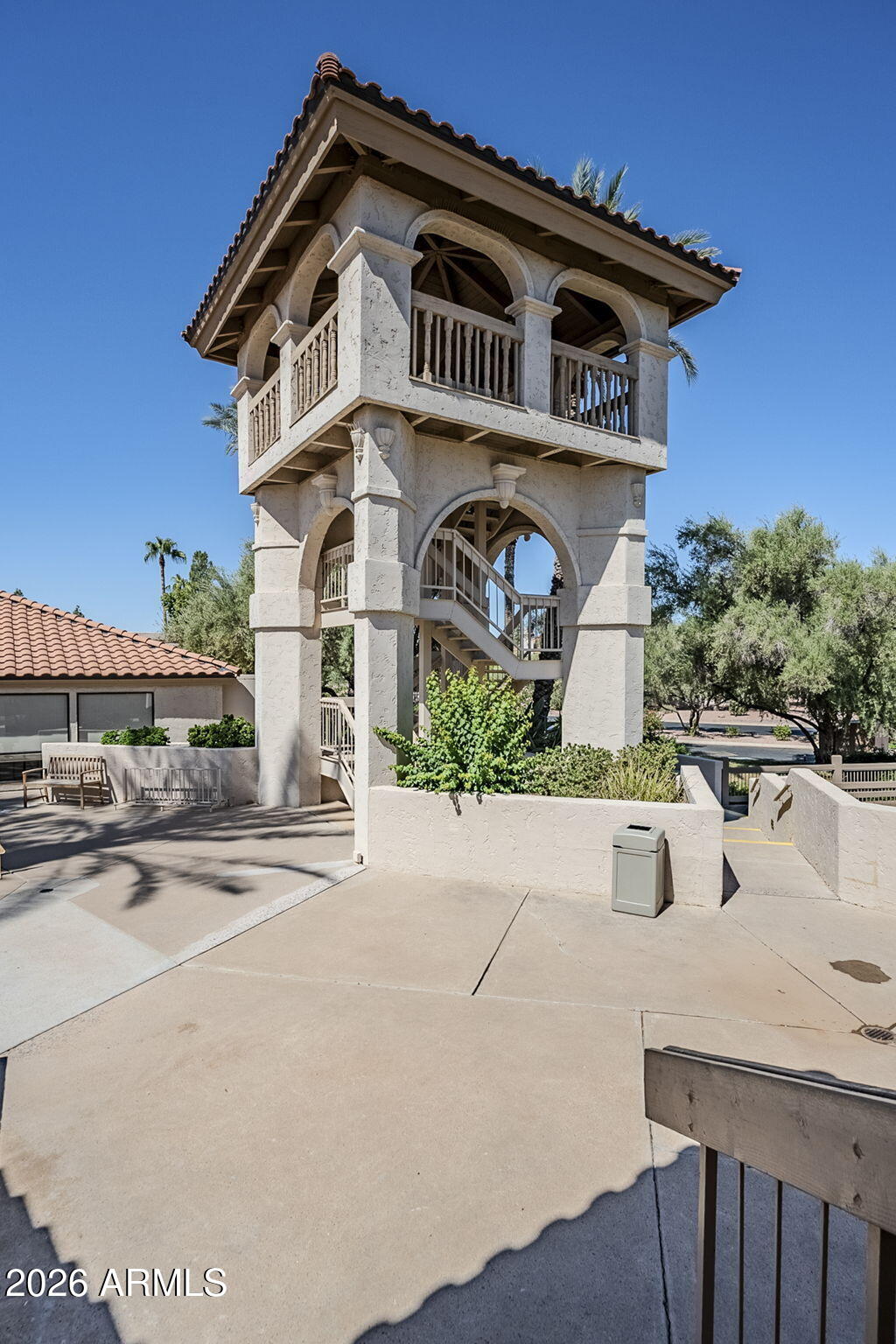 9705 East Mountain View Road, Unit 1036 Scottsdale, AZ 85258 - Photo 39 of 50 a front view of a house with garden