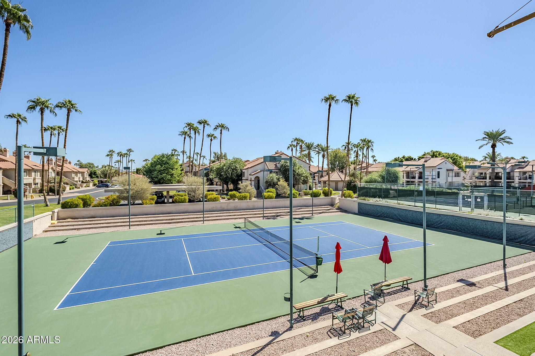 9705 East Mountain View Road, Unit 1036 Scottsdale, AZ 85258 - Photo 42 of 50 a view of a tennis court