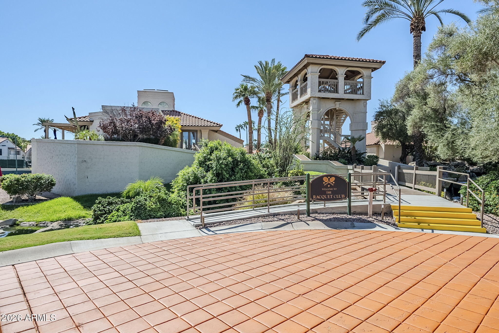 9705 East Mountain View Road, Unit 1036 Scottsdale, AZ 85258 - Photo 47 of 50 a house with pool and sitting area