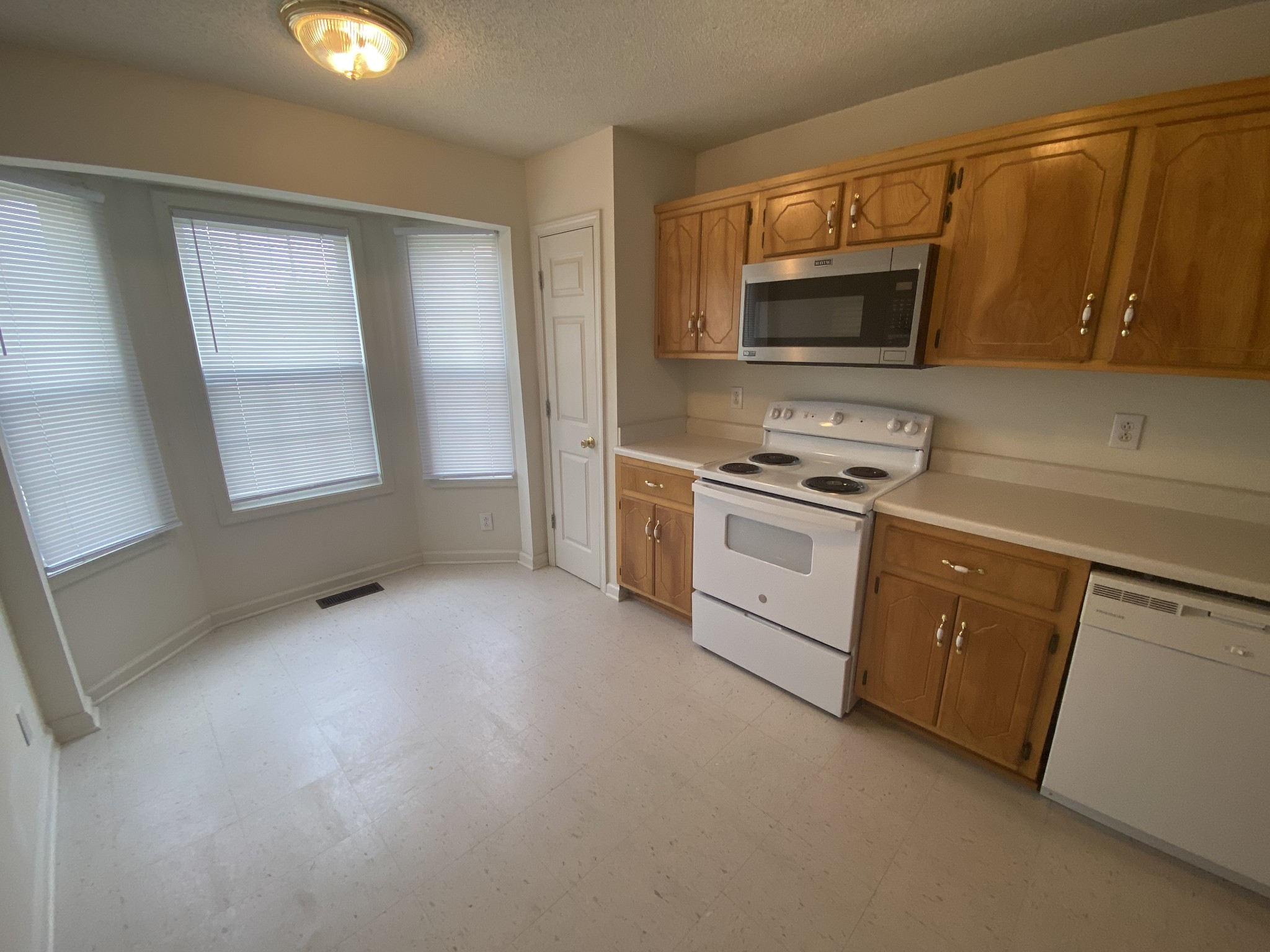 237 Tree Line Drive Oak Grove, KY 42262 - Photo 3 of 13 a kitchen with a stove microwave and sink