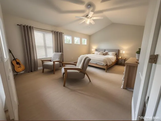 a bedroom with furniture and a large window