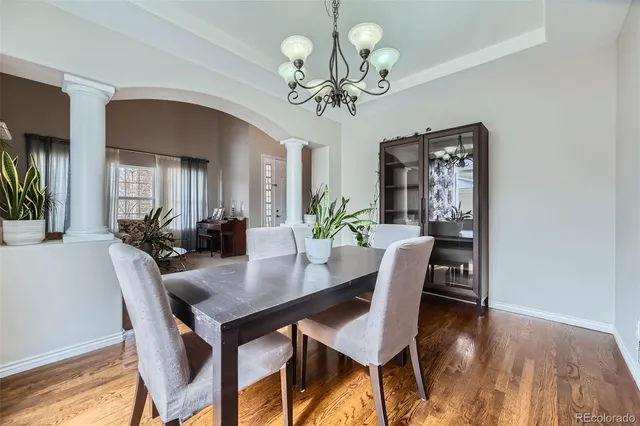 a view of a dining room with furniture and wooden floor