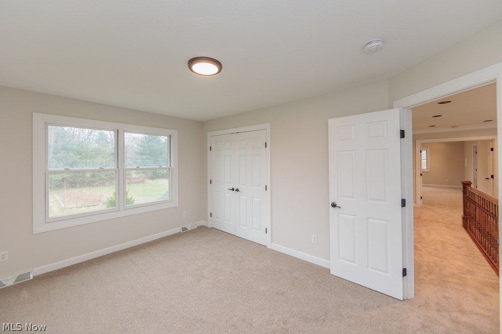 6947 Som Center Road Solon, OH 44139 - Photo 45 of 50 Unfurnished bedroom featuring light carpet and a closet