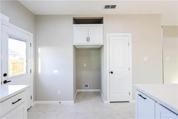 a hallway with rack on the wall