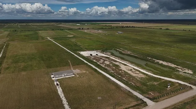 a view of a pool with a table