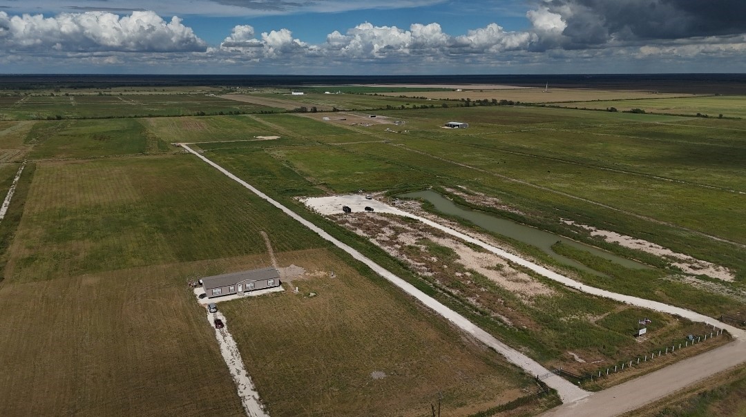 0 Mcdonald Rd Path East Eagle Lake, TX 77434 - Photo 4 of 9 a view of a pool with a table