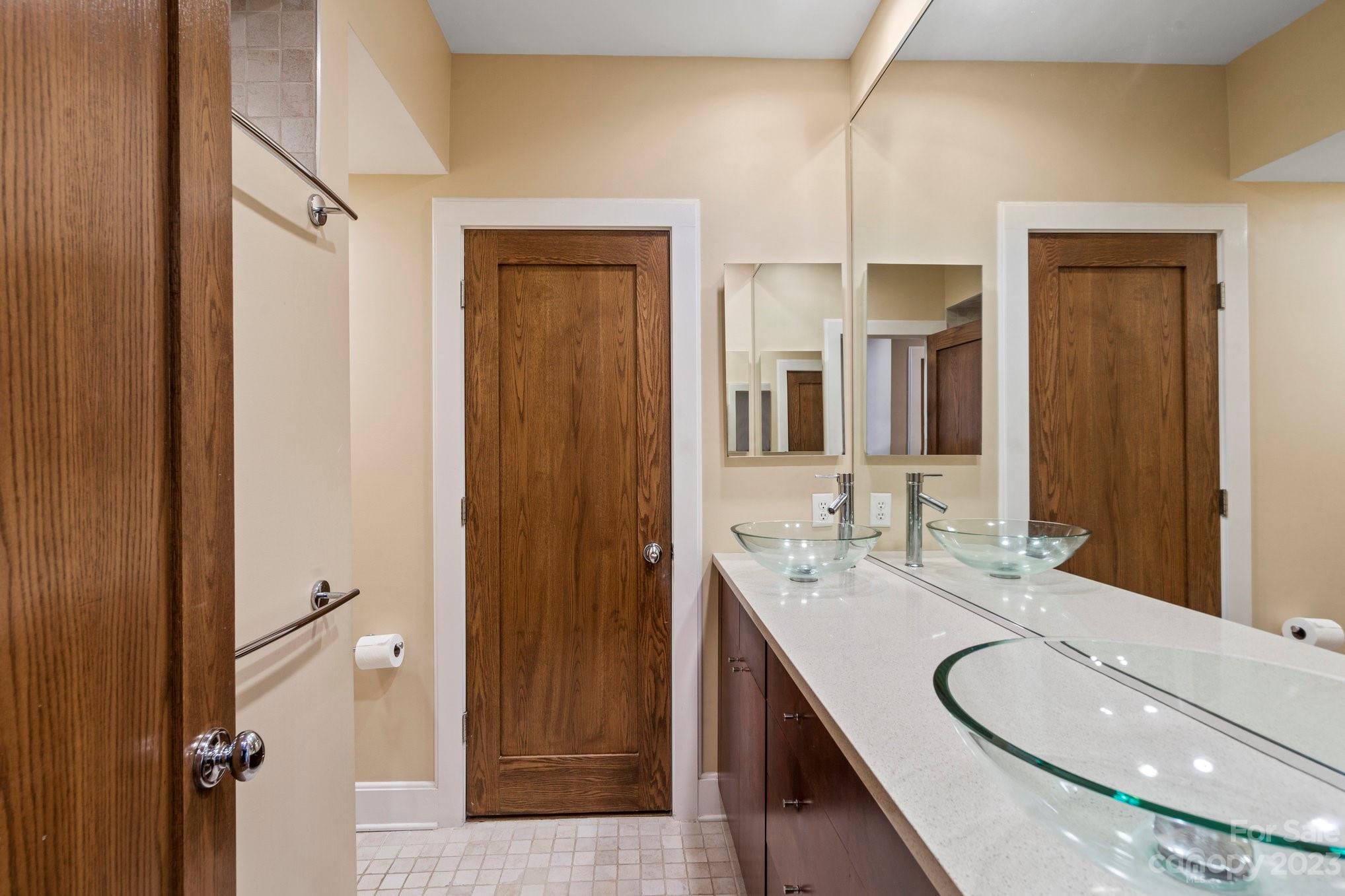 420 Queens Road, Unit 3 Charlotte, NC 28207 - Photo 14 of 35 a bathroom with a granite countertop sink and a mirror