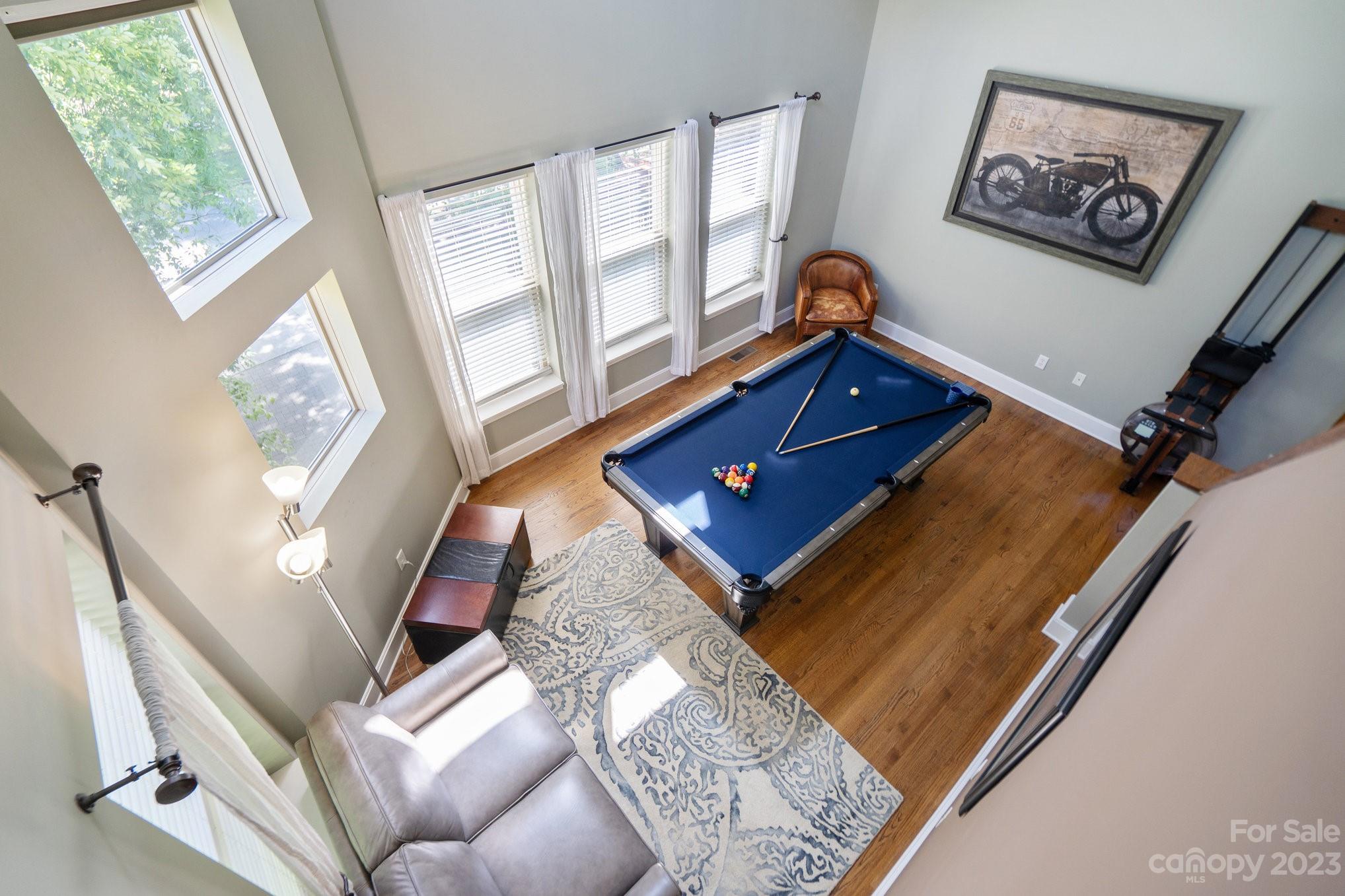 420 Queens Road, Unit 3 Charlotte, NC 28207 - Photo 17 of 35 a living room with furniture and a large window