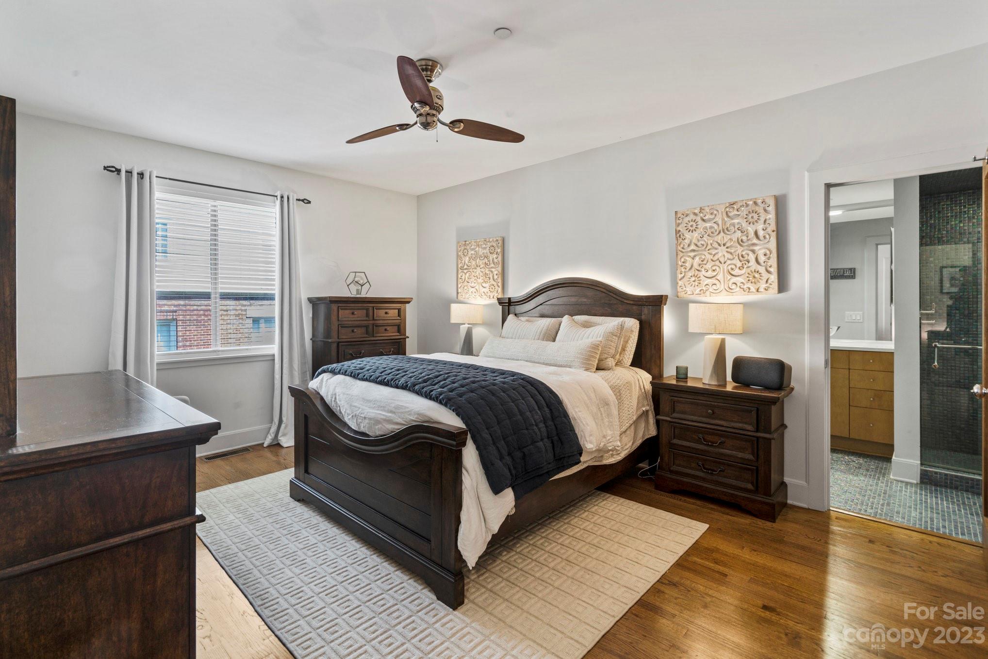 420 Queens Road, Unit 3 Charlotte, NC 28207 - Photo 21 of 35 a bedroom with a bed and wooden floor