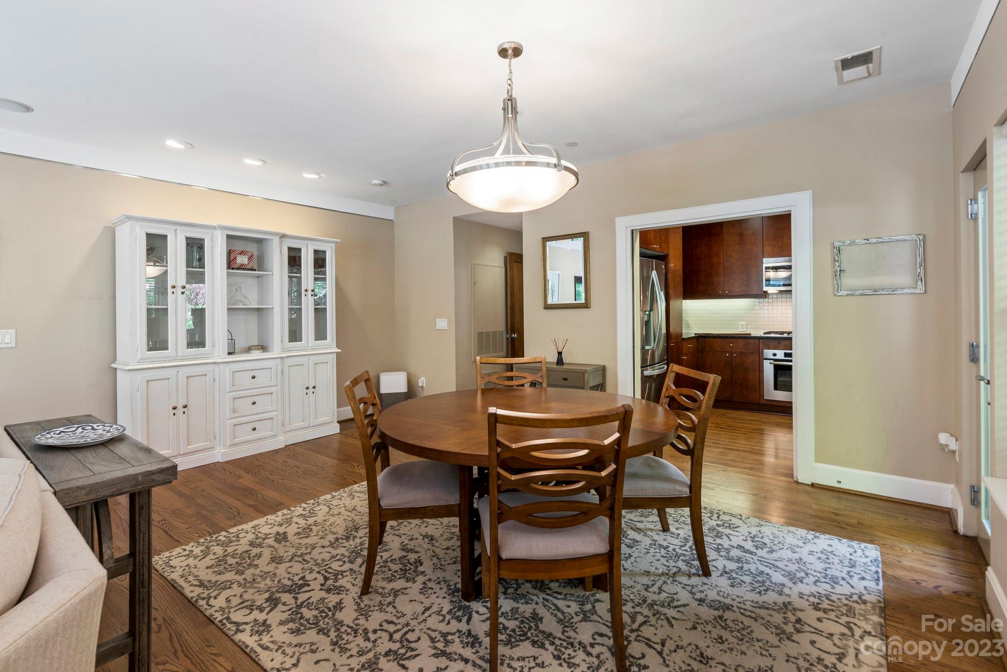 420 Queens Road, Unit 3 Charlotte, NC 28207 - Photo 5 of 35 a view of a dining room with furniture