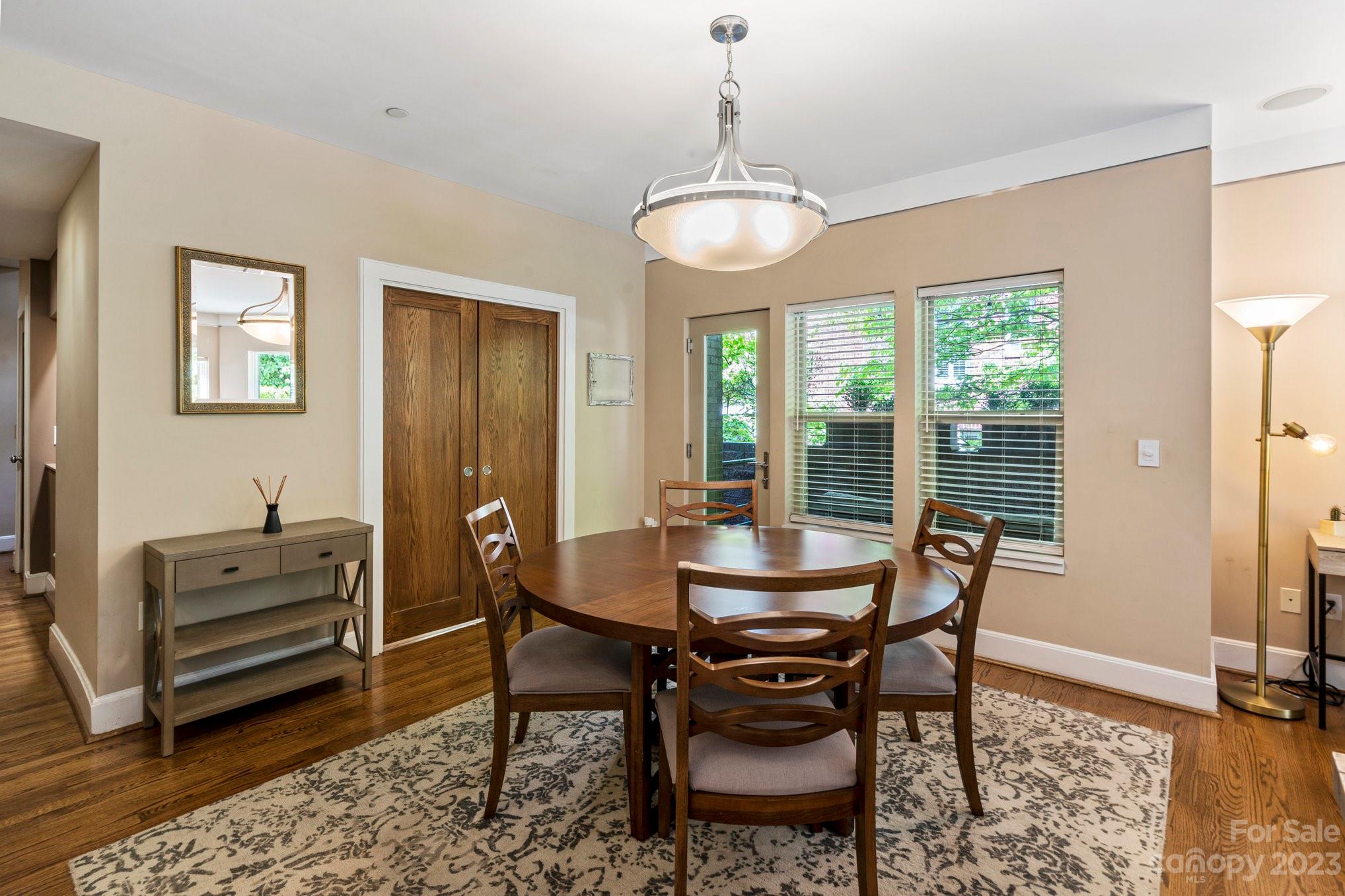 420 Queens Road, Unit 3 Charlotte, NC 28207 - Photo 6 of 35 a view of a dining room with furniture window and outside view