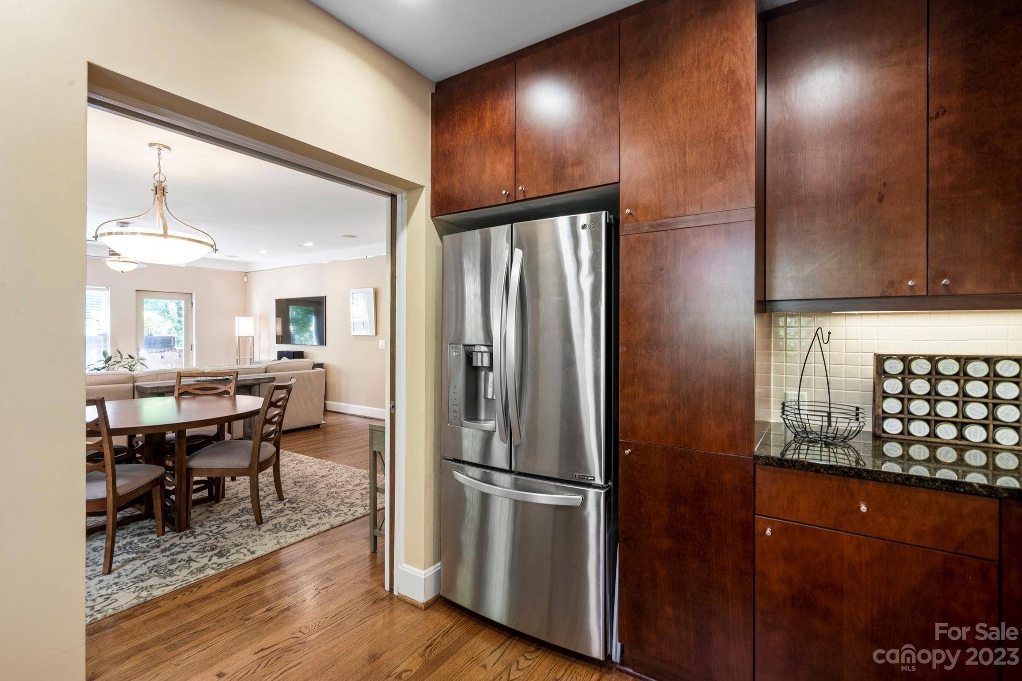 420 Queens Road, Unit 3 Charlotte, NC 28207 - Photo 8 of 35 a kitchen with stainless steel appliances granite countertop a refrigerator and a stove top oven