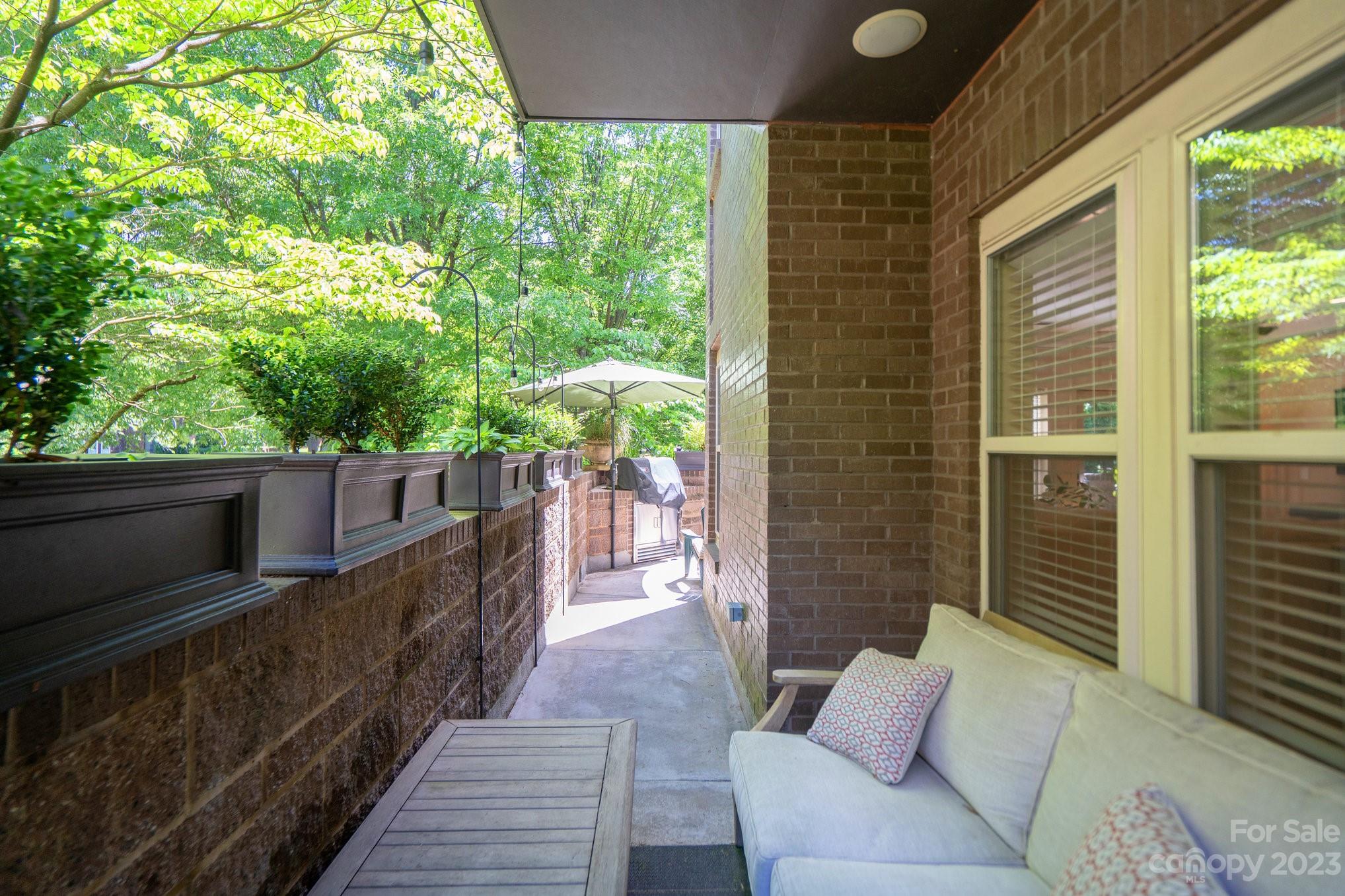 420 Queens Road, Unit 3 Charlotte, NC 28207 - Photo 9 of 35 a balcony with wooden floor and furniture