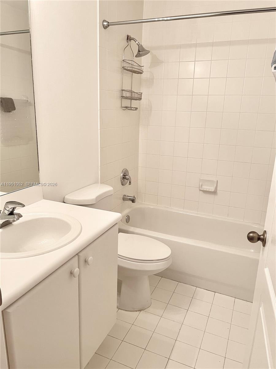 4321 Southwest 160th Avenue, Unit 202 Miramar, FL 33027 - Photo 11 of 18 a bathroom with a sink a toilet and shower