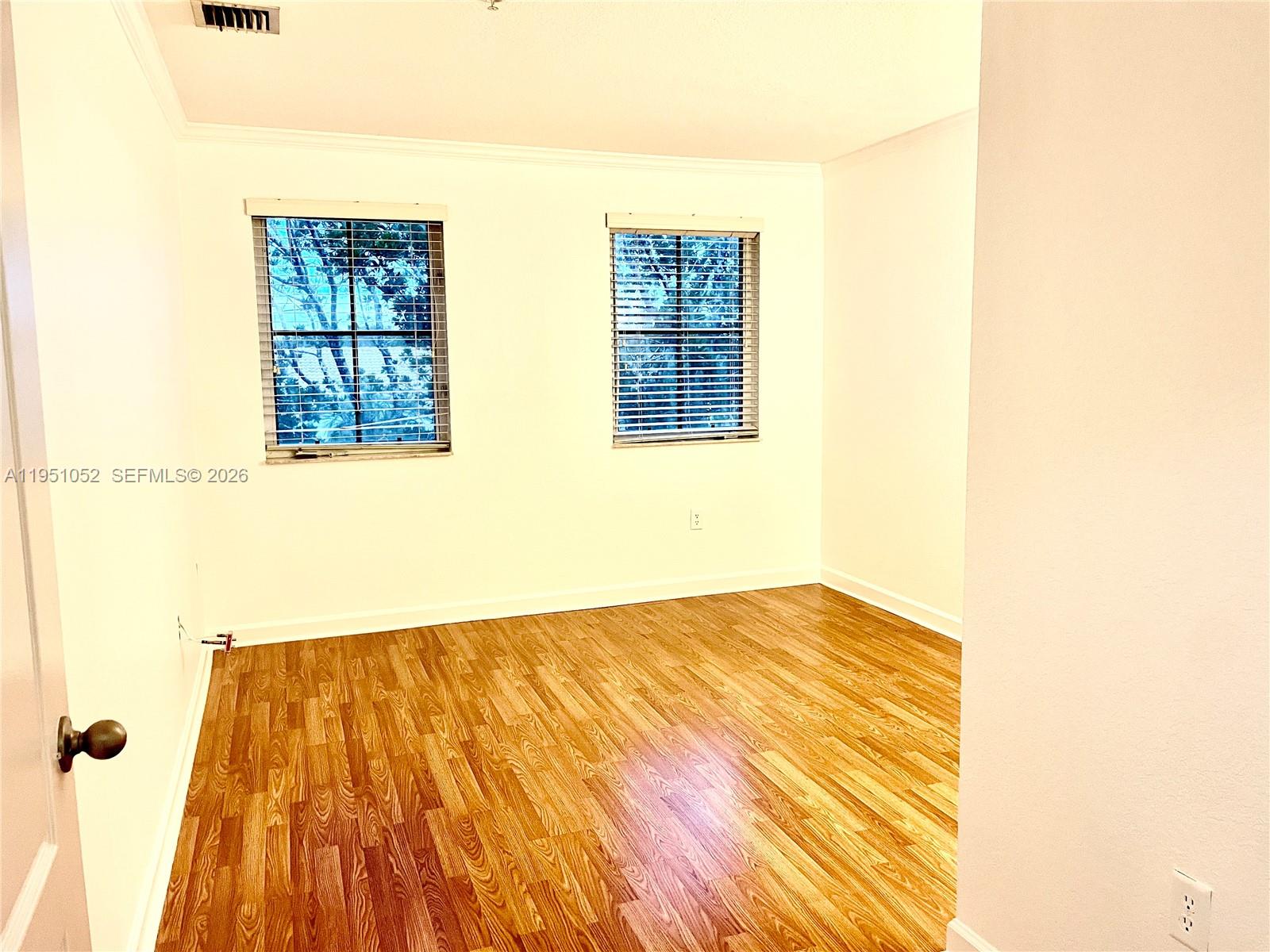 4321 Southwest 160th Avenue, Unit 202 Miramar, FL 33027 - Photo 13 of 18 a view of a bedroom with a bed and a window