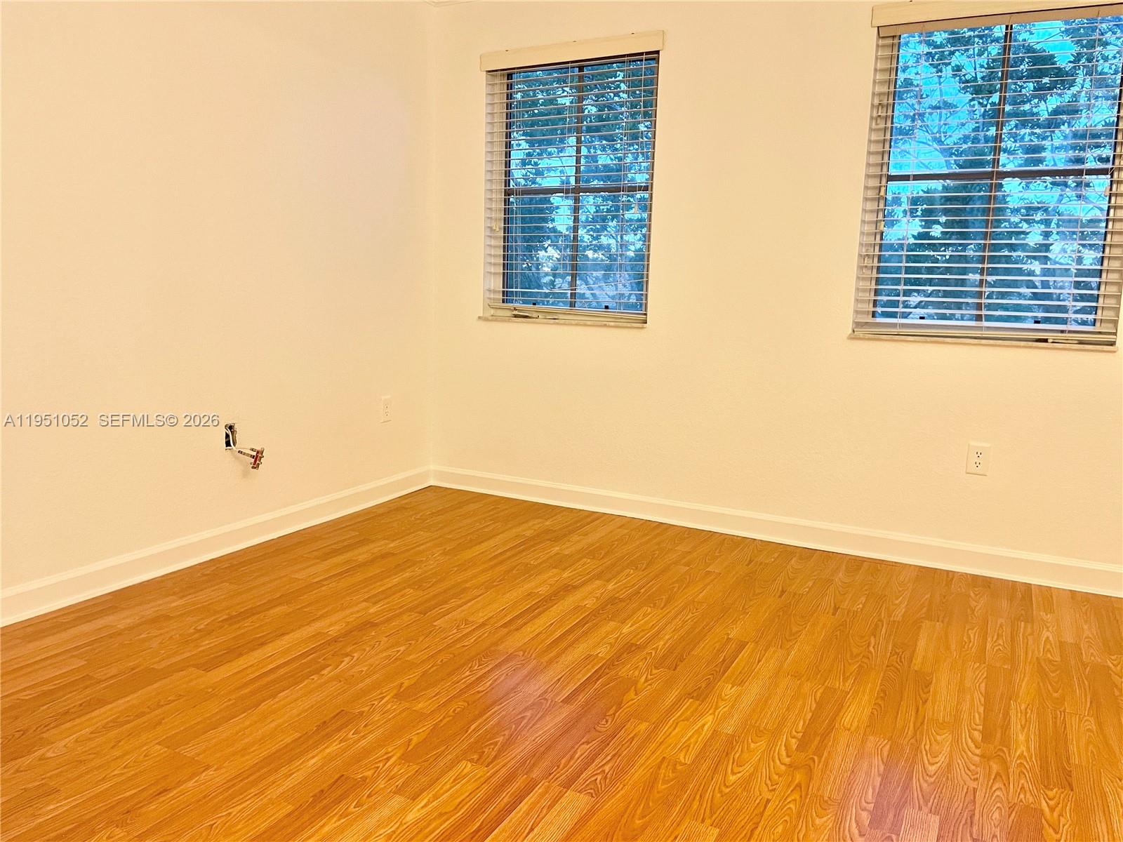 4321 Southwest 160th Avenue, Unit 202 Miramar, FL 33027 - Photo 15 of 18 a view of an empty room and wooden floor