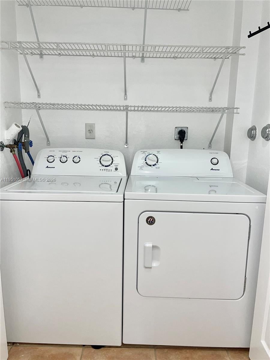 4321 Southwest 160th Avenue, Unit 202 Miramar, FL 33027 - Photo 2 of 18 a utility room with dryer and washer