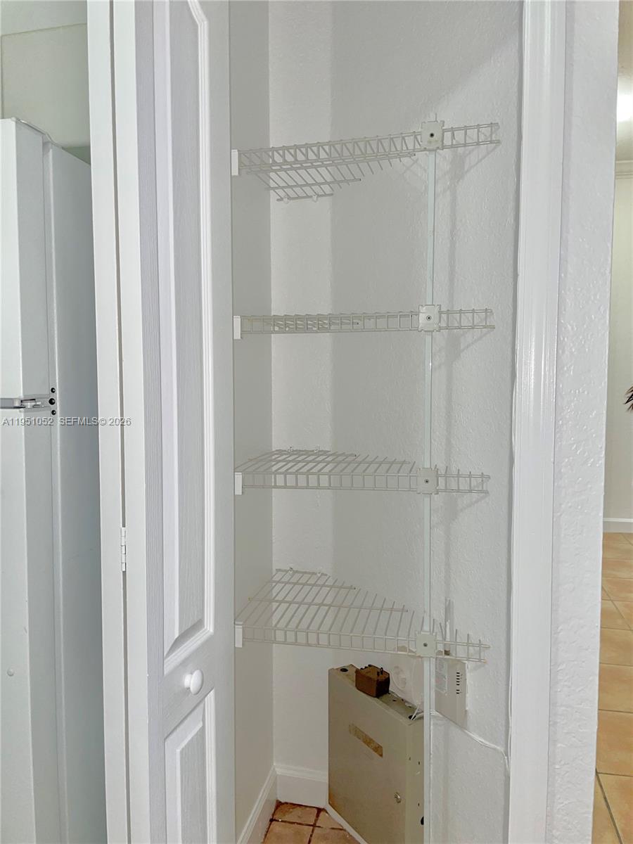 4321 Southwest 160th Avenue, Unit 202 Miramar, FL 33027 - Photo 3 of 18 a bathroom with a glass shower door