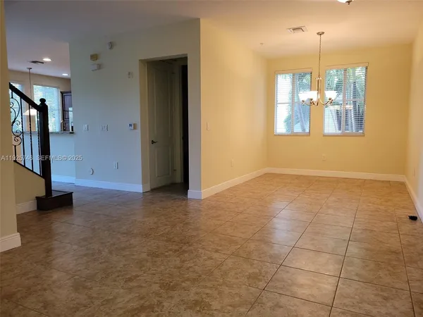 a view of a kitchen with a sink and a window