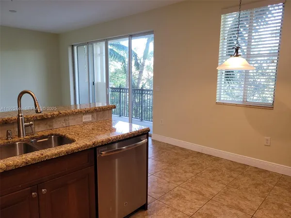 a kitchen with a sink and a window