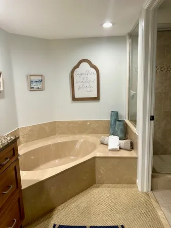 a bathroom with a bathtub and a sink