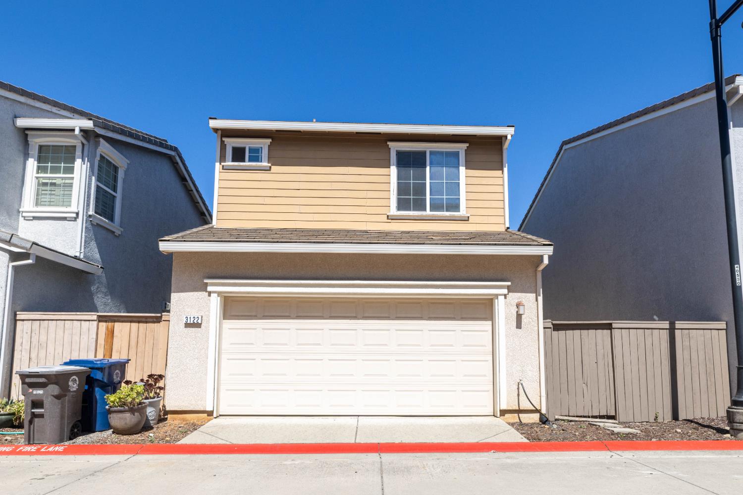 3122 Lea Sterling Way Rancho Cordova, CA 95670 - Photo 31 of 31 a side view of a house with a garage