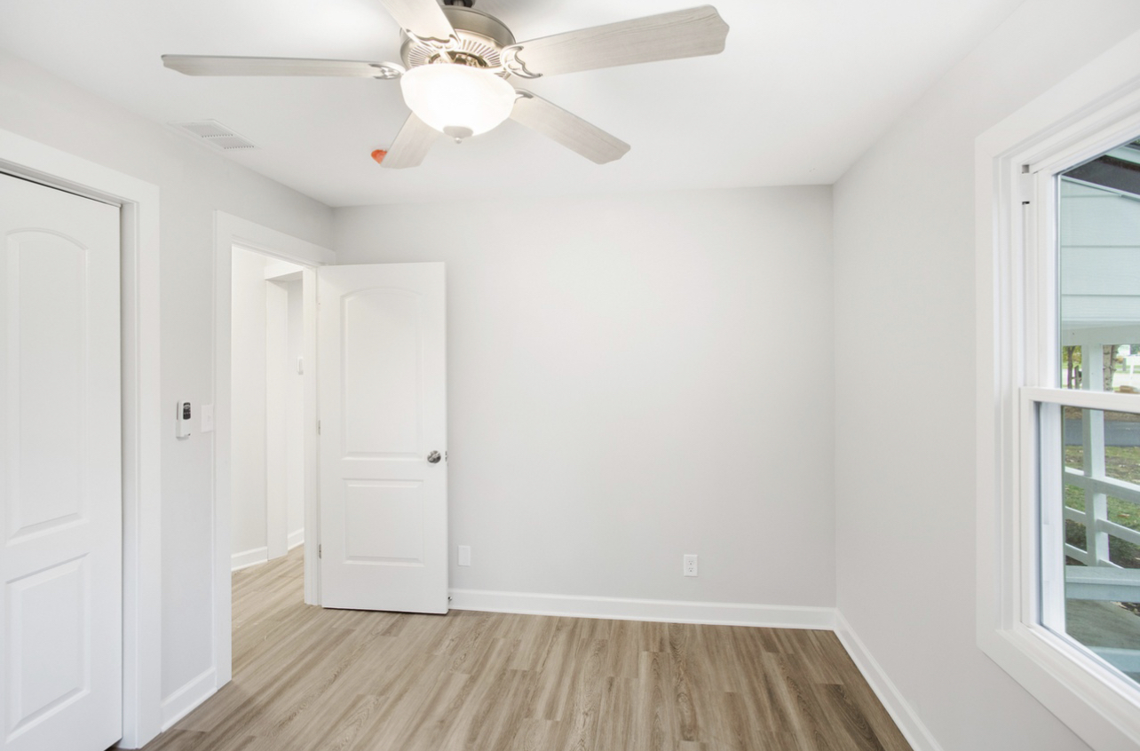 715 Anthony Trail Northbrook, IL 60062 - Photo 11 of 20 wooden floor in an empty room with a window