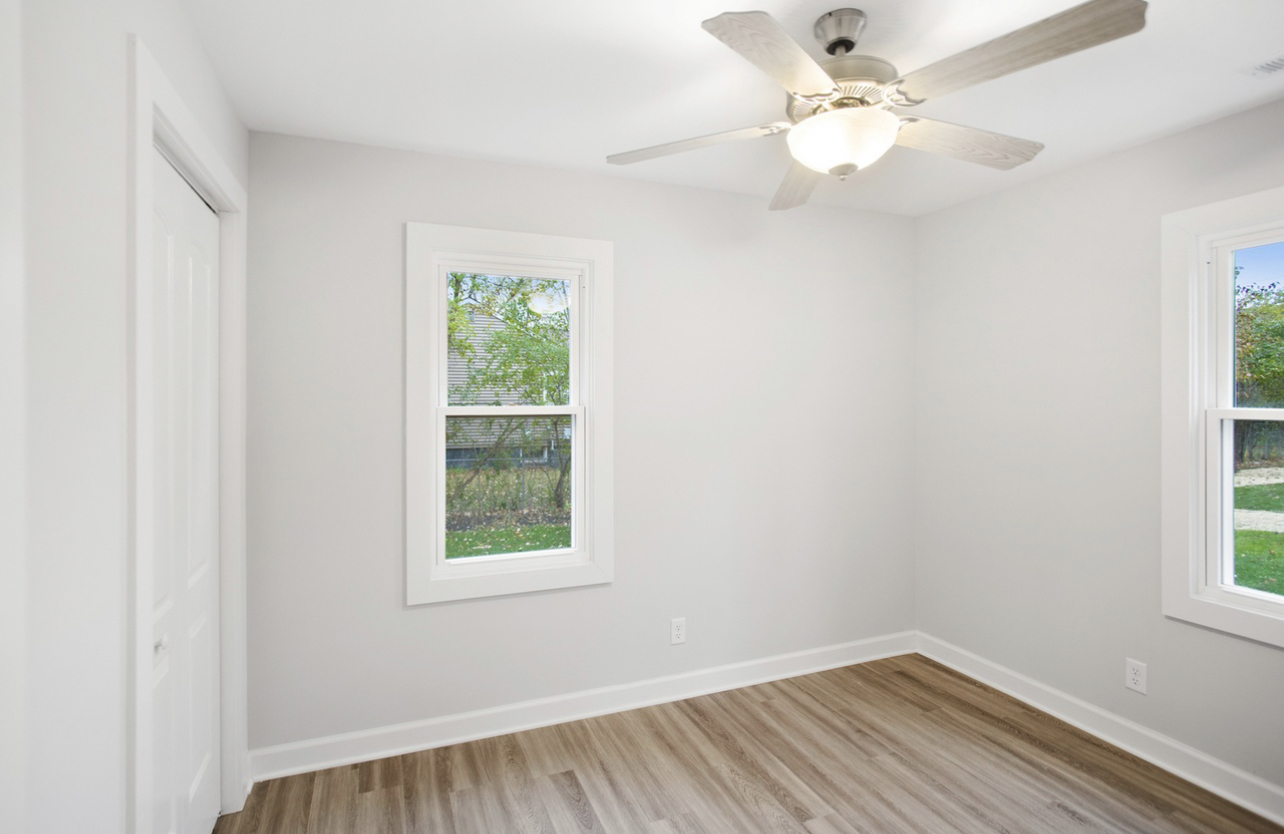 715 Anthony Trail Northbrook, IL 60062 - Photo 12 of 20 an empty room with a window and a fan