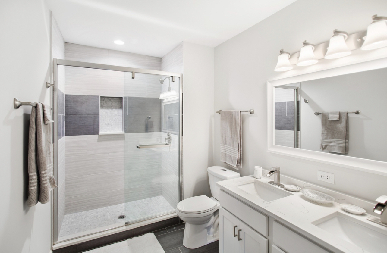 715 Anthony Trail Northbrook, IL 60062 - Photo 9 of 20 a bathroom with a sink toilet and shower