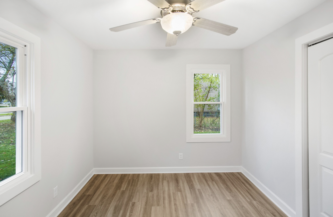 715 Anthony Trail Northbrook, IL 60062 - Photo 10 of 20 wooden floor in an empty room with a window