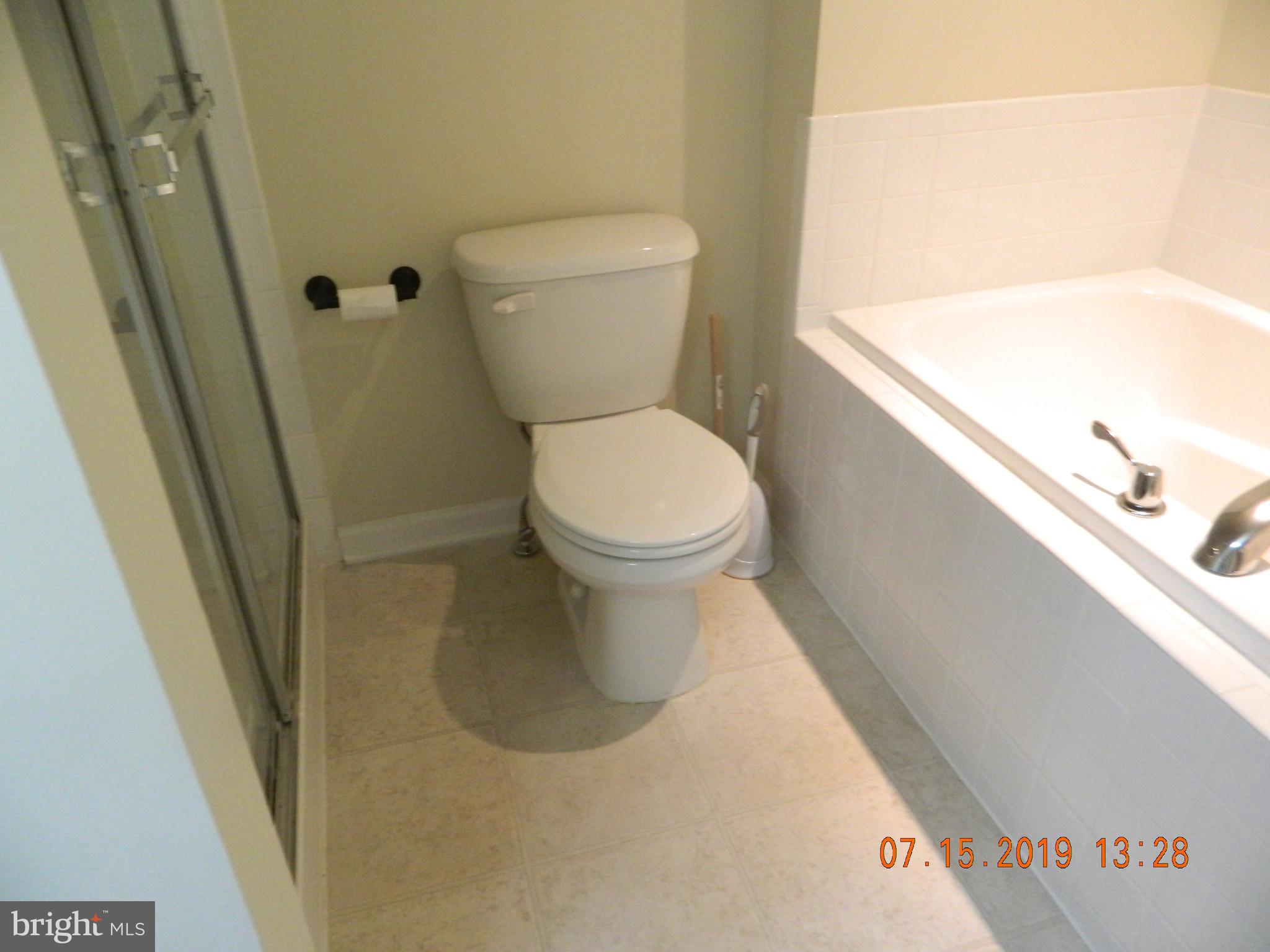 24 Baltic Lane Ranson, WV 25438 - Photo 16 of 35 Master bath separate tub and shower