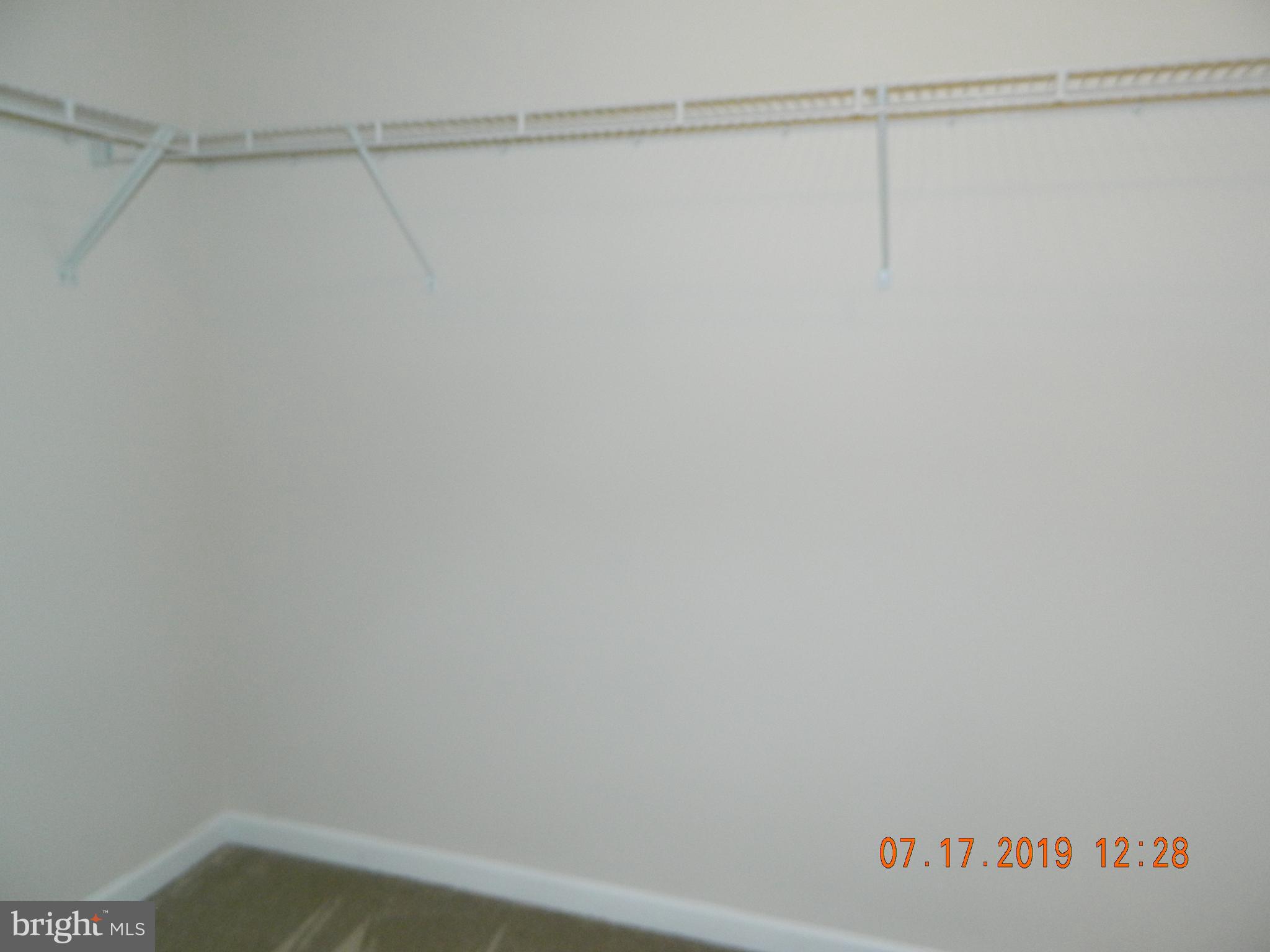 24 Baltic Lane Ranson, WV 25438 - Photo 27 of 35 Master bedroom walk in closet