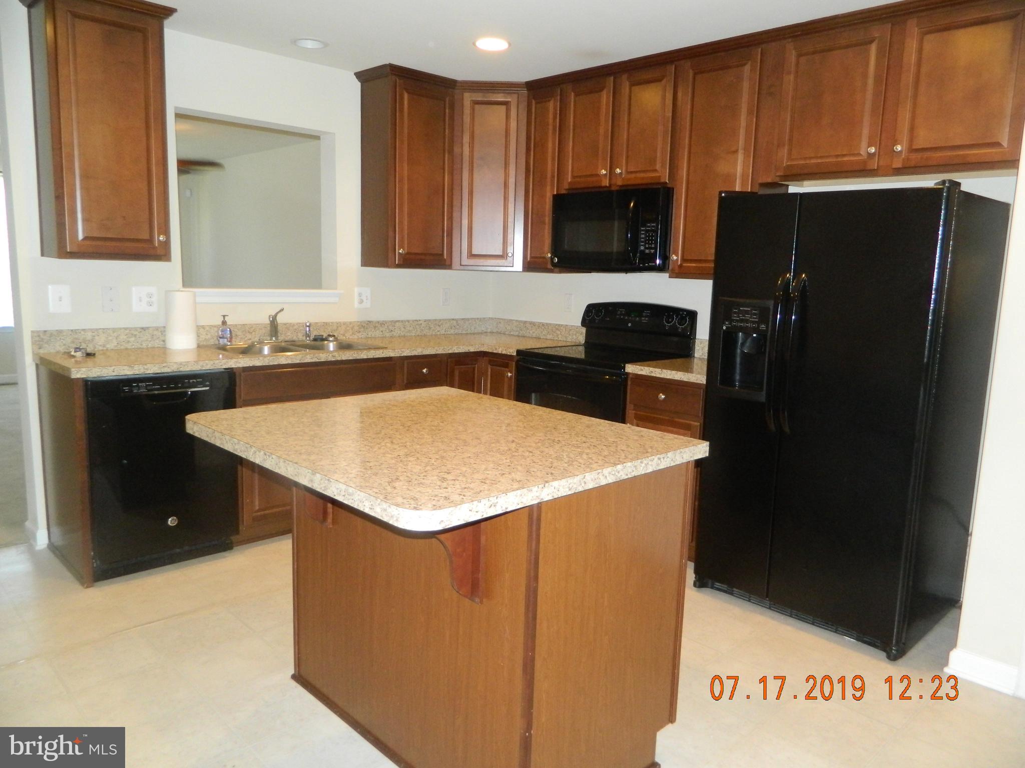 24 Baltic Lane Ranson, WV 25438 - Photo 6 of 35 Kitchen with pass thru to living room.