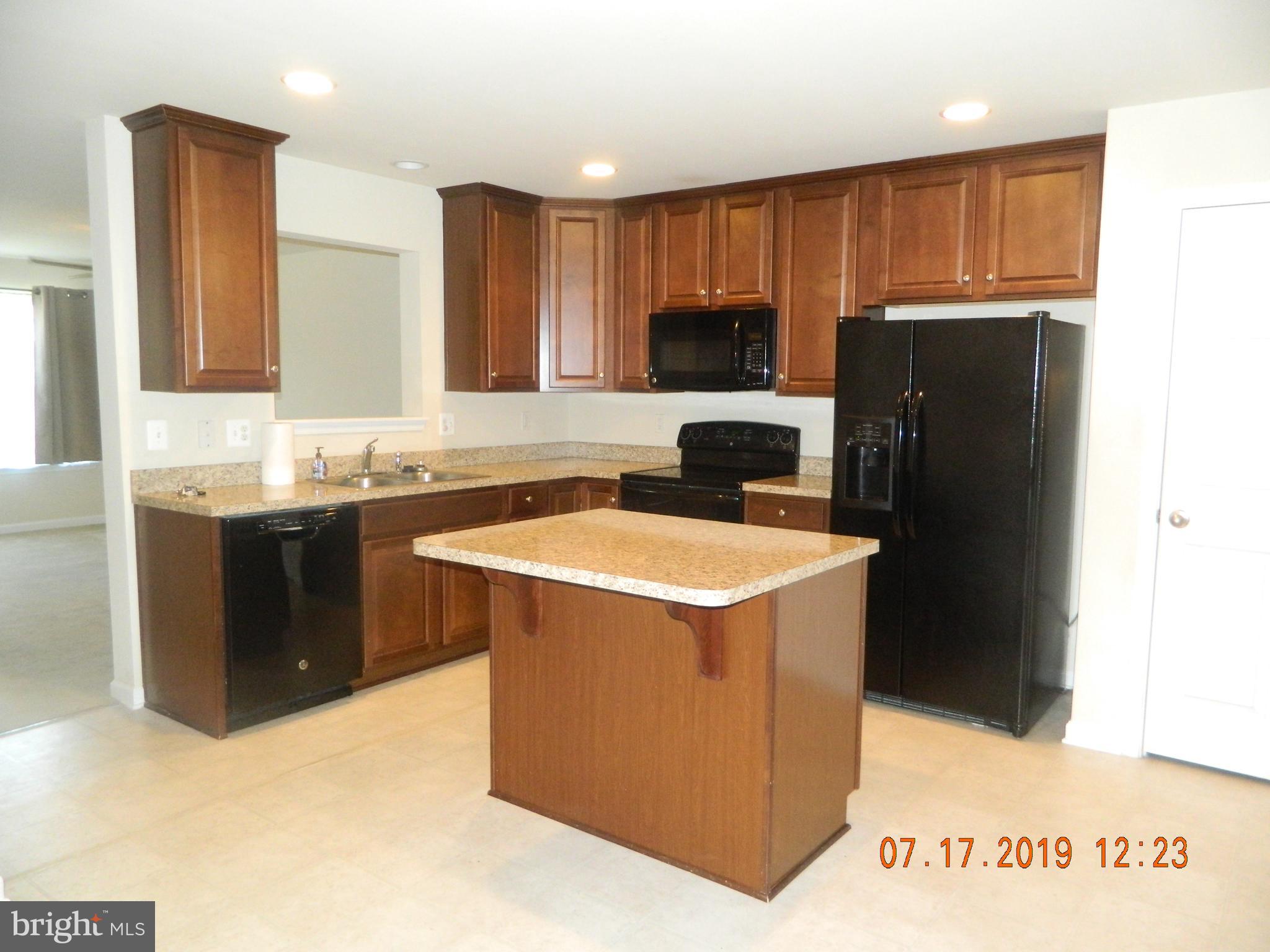 24 Baltic Lane Ranson, WV 25438 - Photo 7 of 35 Center island with room for dining.